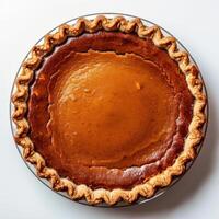 Freshly baked pumpkin pie with a golden brown crust, topped with a sweet and gooey pumpkin filling. photo