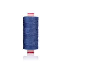 a skein of threads of blue color macro on a white background photo