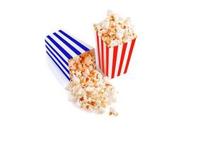 Glass with popcorn on a white background photo