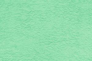Texture of green rough plaster. Abstract design background. photo