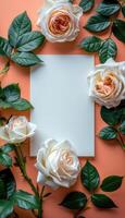 White and Peach Roses with Green Leaves on Coral Background photo