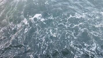 Waves crash in the ocean, evoking concepts of tranquility and connection to nature video