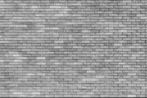 Gray wall of the building. Designer building background. photo
