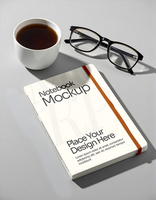 Notebook Mockup with cup coffee background psd