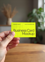Hand holding a square paper mockup on a simple Background psd