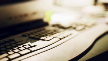 A close up view of a keyboard on a desk with soft ambient lighting video