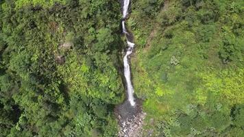 Called Curug Cikawah because this waterfall is located around the crater of Mount Salak, Bogor, Indonesia. Surrounded by dense green forests and a crater that is still actively emitting smoke. video