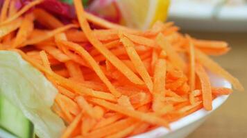 Freshly Grated Carrots Served in a Light and Refreshing Salad Bowl for Enjoyment video