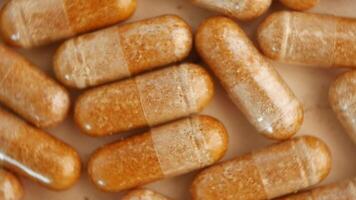 A detailed closeup view of various supplements and capsules displayed together video