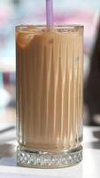 Enjoy a Refreshing Iced Coffee, complete with Ice Cubes in a Clear Glass for your delight video