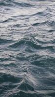 The serene and calm ocean waves are accompanied by subtle ripples and a shimmering reflection video