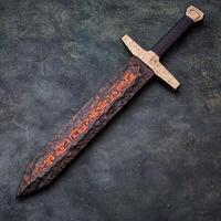 Ornate dagger with ancient script photo