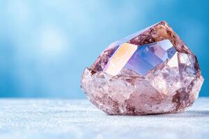 Stunning quartz crystal on a snowy surface photo