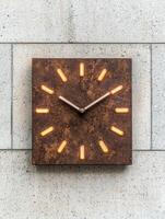 Illuminated modern wall clock with abstract design photo