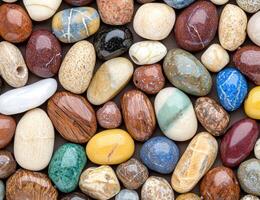 Colorful assorted river rocks and pebbles photo