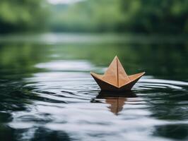 paper boat floating on a calm lake photo