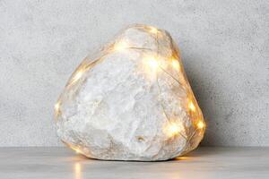 Glowing crystal rock with string lights photo