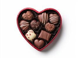 heart shaped box of assorted chocolate candies photo