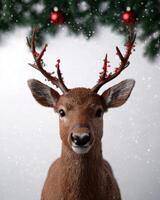 Festive deer with antler decorations in snowy winter scene photo