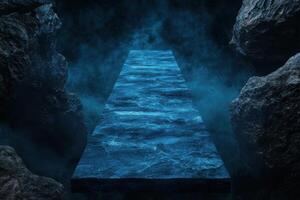 A path leading to a dark cave with blue water photo