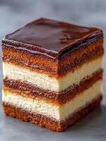Delicious layered chocolate cake with caramel topping photo