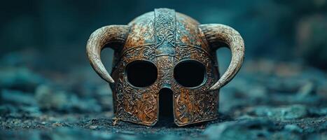 Ornate medieval helmet with horns on a dark background photo