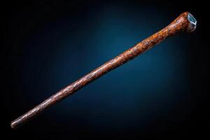 A long wooden stick with a black handle photo