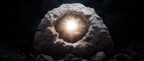 An image of a rock with a sun shining through it photo