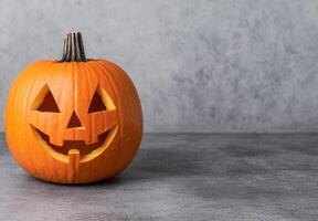 Carved pumpkin with spooky face photo