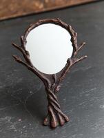 Rustic mirror with twisted branches frame photo