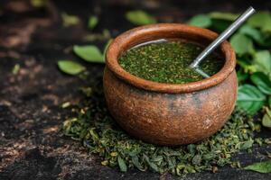 Herbal tea in a rustic wooden bowl photo