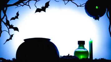 spooky halloween setup with a cauldron a potion bottle a candle photo