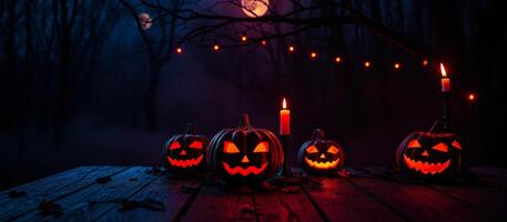 glowing jack-o'-lanterns on a rustic table photo