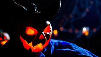 glowing pumpkin with a demonic grin photo