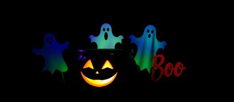 glowing jack-o'-lantern with three ghosts photo