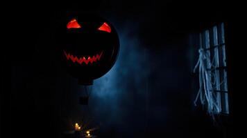 scary black balloon with an face floats the dark photo