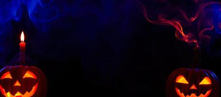 glowing jack-o'-lanterns with blue red smoke photo