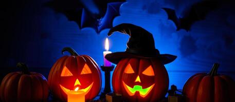 illuminated jack-o'-lanterns with a witch's hat create a spooky halloween scene photo