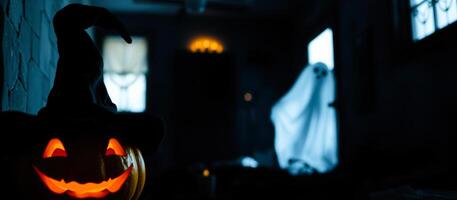 lighted pumpkin stands guard a spooky room photo