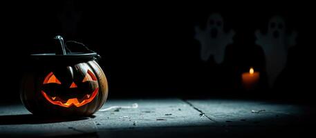 lighted jack-o'-lantern with ghostly figures photo