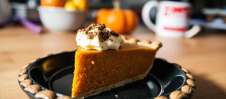 slice pumpkin pie with whipped cream chocolate shavings photo