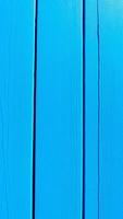 close- textured blue surface with vertical grooves photo