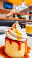 single serving cheesecake with caramel sauce whipped cream photo