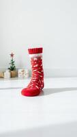single red sock with a festive holiday design photo