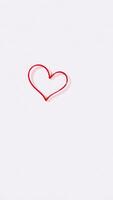red heart shape against a white background photo