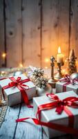plata regalo cajas con rojo cintas iluminado por un vela foto