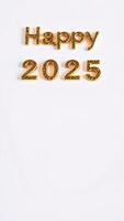 golden glitter letters spell out 'happy 2025' on a white background photo