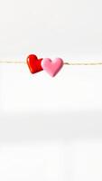two hearts hanging on a string photo