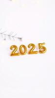 golden inflatable numbers representing 2025 photo