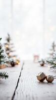 two gold ornaments with snowflake designs on a rustic whitewashed wood surface photo